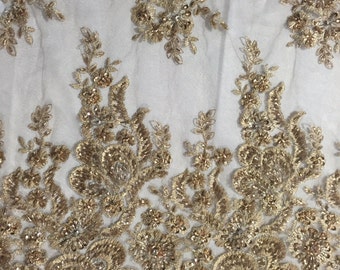 Ivory flowers embroider and heavy beaded on a mesh lace fabric-sold by the yard. main image 0