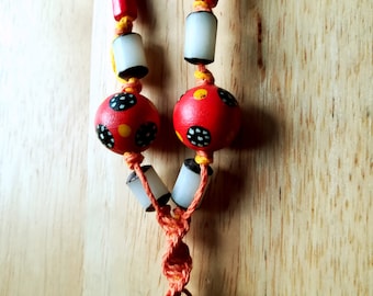 The 'Earth-Sun' necklace, hemp, Buri Nut, Sebuca Seeds, Wood.