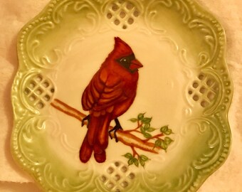 Red cardinal hand painted on a decorative plate