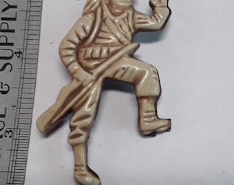 Gold toned plastic army man pin brooch used