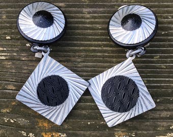 Foil and Black patterned plastic clip on earrings 1950s?