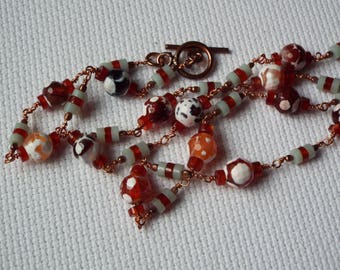 Agate, amazonite, and carnelian beads in a 23 inch necklace