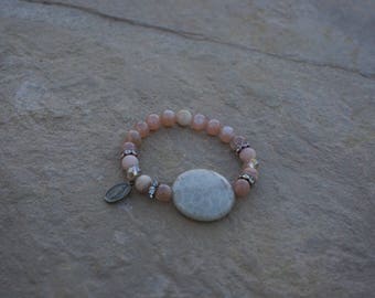 Sunstone beads with large center stone and bronze Blessed Mother Charm