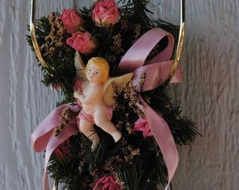 Set of 2 metal tapered candle holders with cherub angel and pink flower decoration