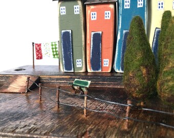 Wonky Little Wooden Houses feature in this Driftwood Sculpture, a Coastal Art piece made from Recycled Wood, a wonderful gift for the home