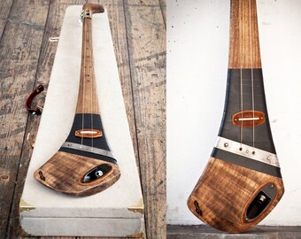 Handcrafted electric slide guitar by DaShtick. Aul boy diddley bow. Cbg