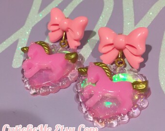 Pink Unicorn On A Holographic Heart And Bow Dangle Earrings