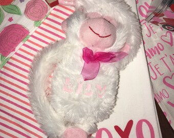Plush stuffed animal personalized with name.