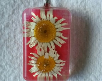 White flower/red sand pendant