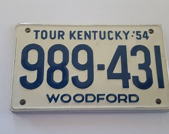 Vintage 1954 Wheaties Cereal premium mini license plate, Kentucky, Tour Kentucky Woodford, measures 3 7/8" x 2 1/4"