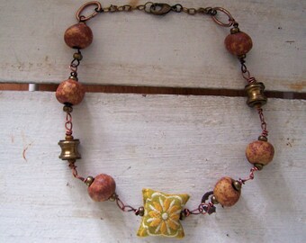 Hiske .... A unique recycled necklace in vintage materials and color.
