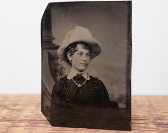 Antique tintype of young girl in hat