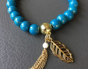 Blue and gold beaded stretch bracelet