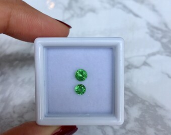 Electric green Tsavorite garnet set total 0.61 ct. unheated from Tanzania.