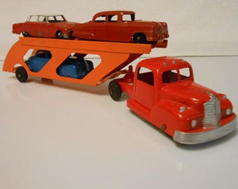 1950's Tootsitoy Car Carrier with Three 40's Roadsters