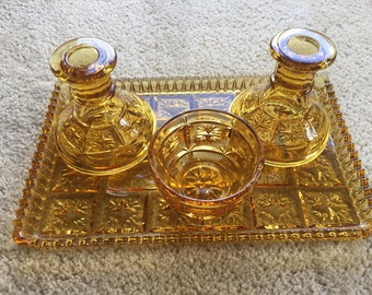 Amber pressed glass dressing table set