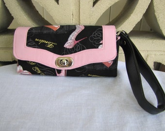 Black wallet with pink shoes