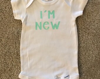 I'm new here onesie