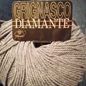 One full skein, tagged Discontinued Yarn, Grignasco Diamante, fine merino yarn with cashmere, soft gray color