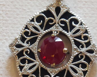 18 k white gold diamond onyx and ruby pendant