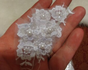 White pearl appliques A Lot of them.