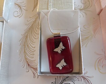 Stunning red transparent glass pendant with silver butterflies