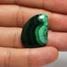 100 % Natural Malachite Cabochon Freeform Shape. Pendant size Cab. 29x20x5 mm. 27.90 Cts.