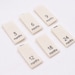 Printed Cotton Size Tabs - 3 Months to 24 Months - Natural Color Labels w/ Black Letters - Center Fold - 0.375"(W) x 0.75"(H) Folded Size