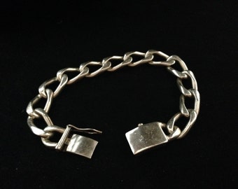 A very large and heavy Sterling silver link bracelet with safety clasp.