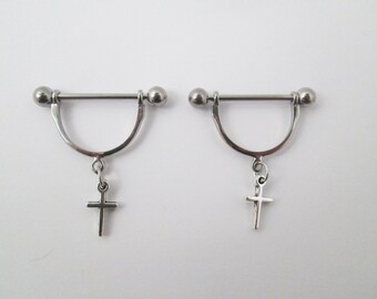 Cross nipple piercing