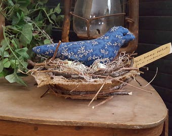 The bees told the robin - primitive robin in a nest with eggs shelf sitter