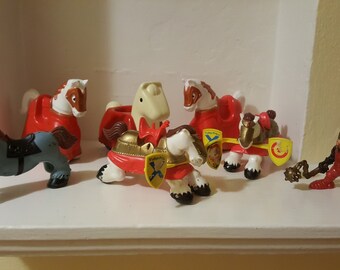 Vintage Fisher Price armored horses have come galloping to the 21st century -- traveling across hundreds and hundreds and hundreds of years