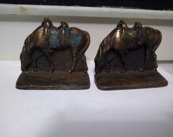 Bronze or copper (not sure which) riderless horse w/saddle bookends.