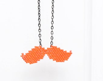 Hand woven orange mustache necklace