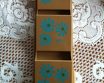 A Plastic Three Compartment Wall Organizer Key Holder With A Blue Daisy/Flower Design That Reads Letters, Notes, Misc