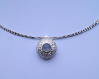 Silver sea urchin pendant as a necklace with Chalcedon