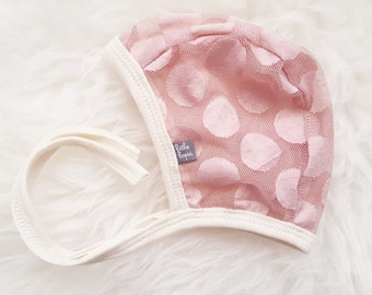 Blush Dot lace pilot hat by Little Lapsi. Baby hat with ties. modern hearing aid