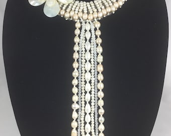 Long dangling pearl necklace