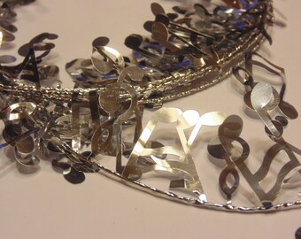 8 feet of shinny silver music note garland, (HR22)