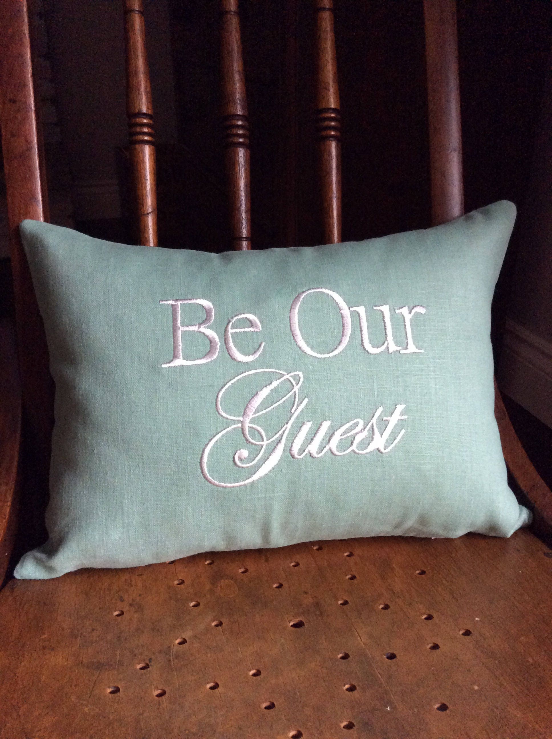 Decorative pillow coverBe Our Guestguest room bed and