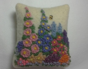 Hand embroidered pincushion with cottage garden flowers and bee