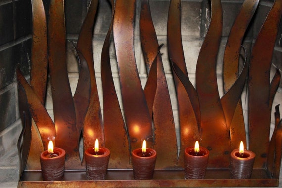Metal Candle Holder Tabletop Sculpture / Fireplace Insert This is a custom made tabletop candle holder / sculpture with a copper patina. This piece can also be used as a fireplace insert and has a modern organic vibe that really speaks for itself. This piece is made to order so it may vary slightly from the pict