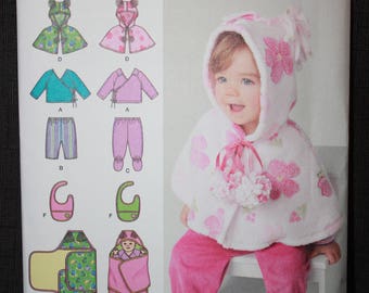 Simplicity 1564 Babies Top, Pants, Capelet, Bib and One Size Blanket Wrap in Sizes XXsmall - Large