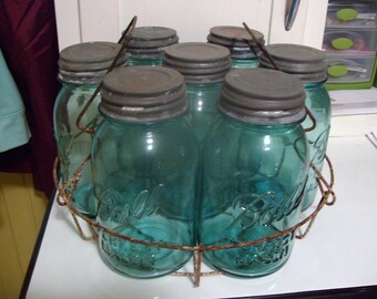 Seven Ball Jars with Zinc Lids in Old Canner Rack