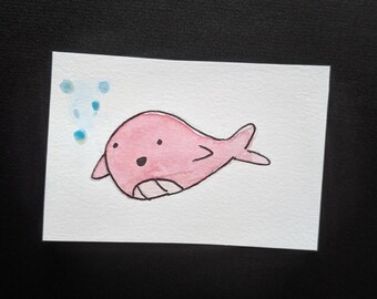 pink whale wowed by bubbles