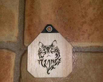 Pendant with stylized cat in leather and wood