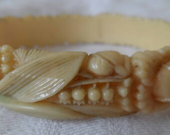 1930's celluloid flower bangle with lilly of the valley, roses etc