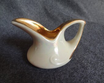 Lusterware cream colored small pitcher