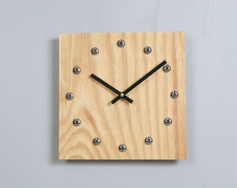 Plywood clock with stainless steel hour markers and Tung oil finish. USPS priority shipping to USA included