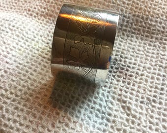 White metal napkin ring .